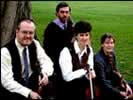 Bingham String Quartet sitting outside with their instruments