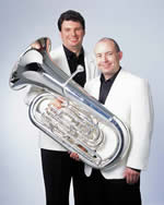 Travelling by Tuba in white jackets holding a tuba