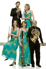 The Galliard Ensemble standing with their instruments
