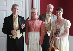 Concert Royal in period costume standing in period property