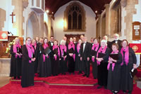 The Harmonium Singers stading in a church