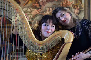 Gabriella Dall’Olio & Anna Noakes sitting together with their harp & flute