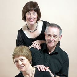 In Voice and Verse performers posing for photo with pale grey background